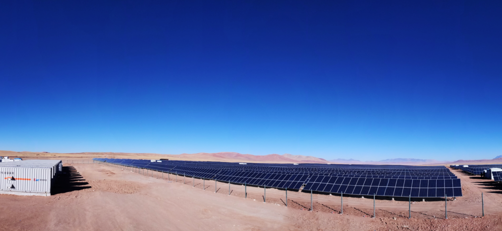 Image of solar farm in the desert with a storage unit